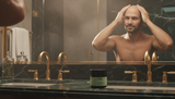 Person massaging Good Bald pre-shave polish into scalp